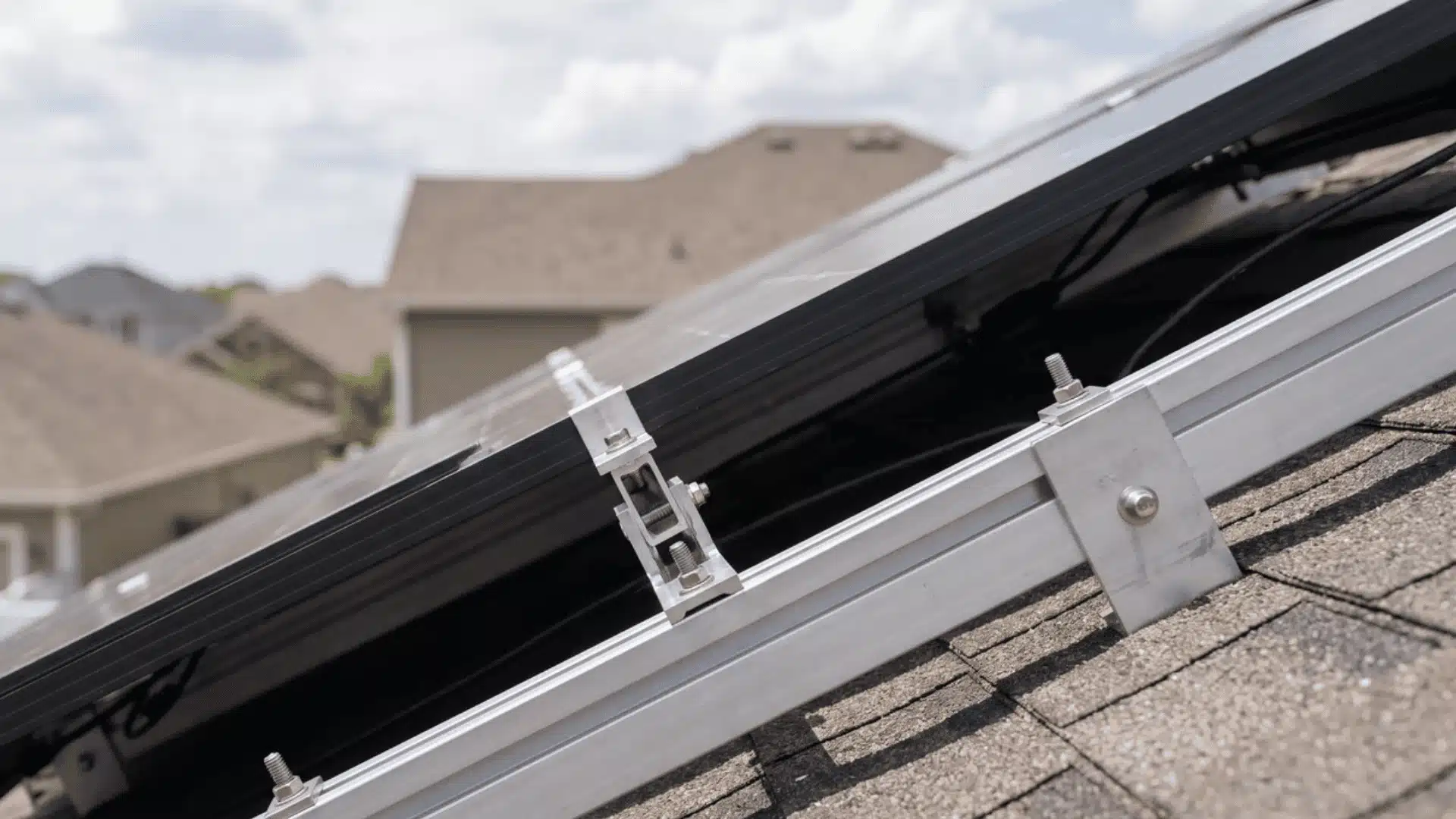 Close-up of solar panel mounting bracket showing adjustable tilt mechanism