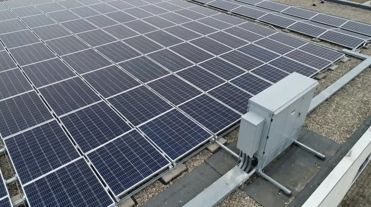 Commercial rooftop solar array with an electrical junction box and conduit wiring