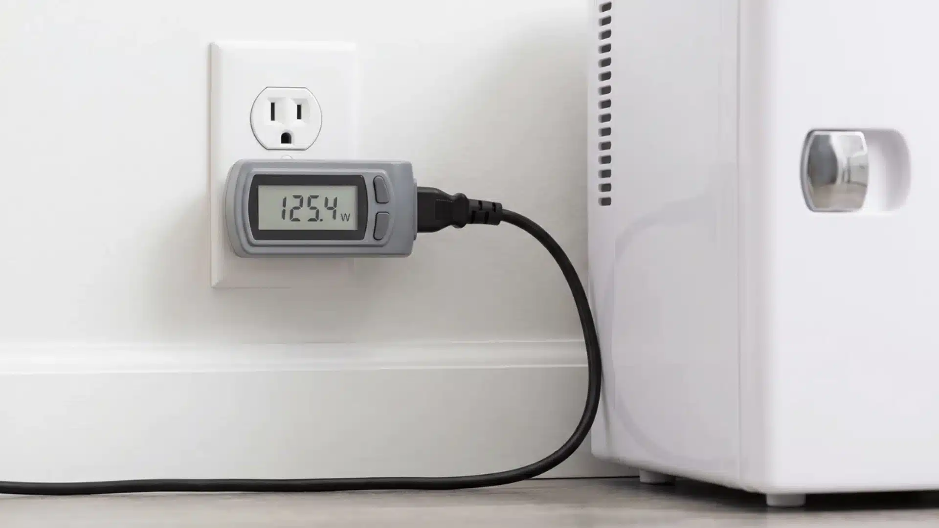 plug-in power meter attached between mini fridge cord and wall outlet