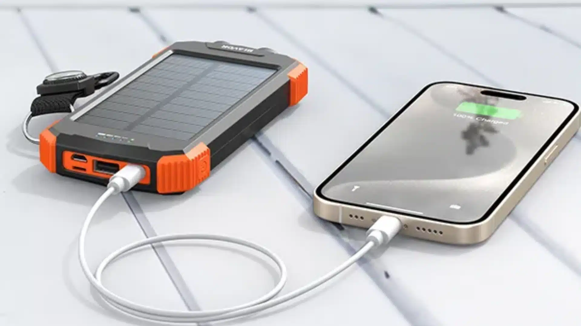 Compact solar power bank charging a phone on a beige background